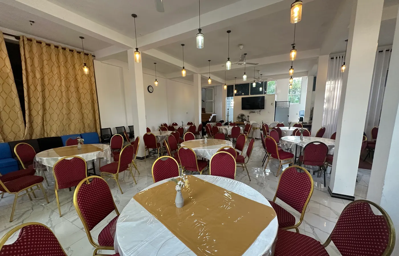 Elegant banquet hall set for a wedding celebration at White House Galaha